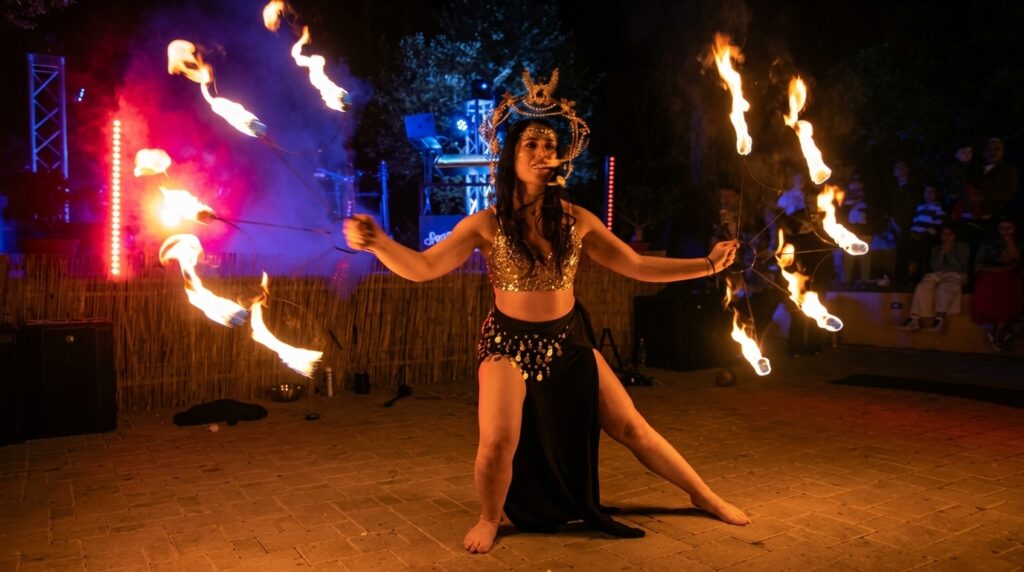 Madame Ekatè è una performer e artista del fuoco salentina specializzata in danza, giocoleria e manipolazione della fiamma. Con anni di esperienza in festival, matrimoni ed eventi in tutta Italia, offre spettacoli eleganti e suggestivi che uniscono tecnica circense, teatralità e un profondo legame simbolico con l'elemento fuoco. Adatta la performance a qualsiasi contesto, creando atmosfere uniche e indimenticabili.